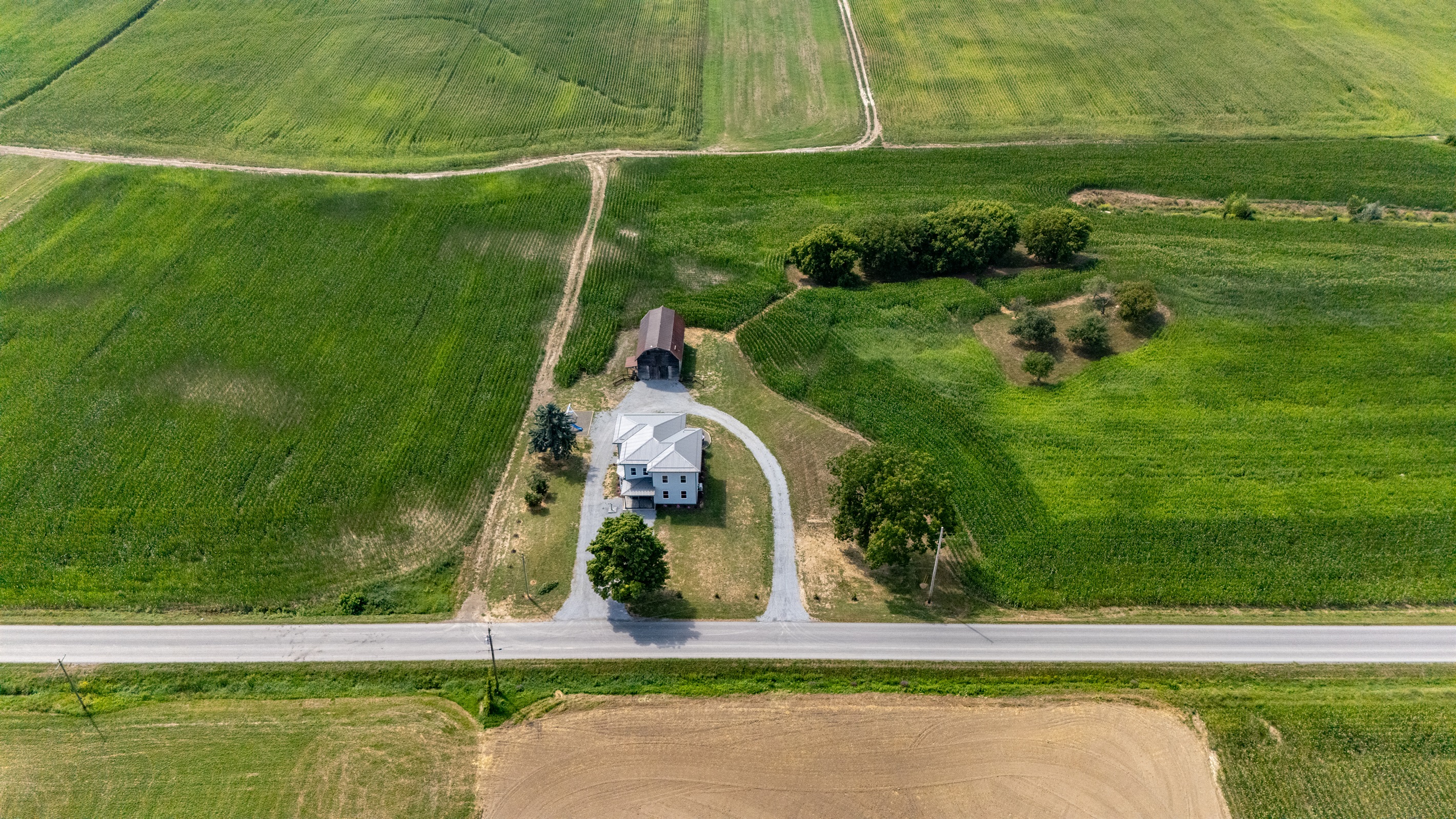 Bird’s-eye view showcasing endless farmland and privacy—ideal for serene country living.