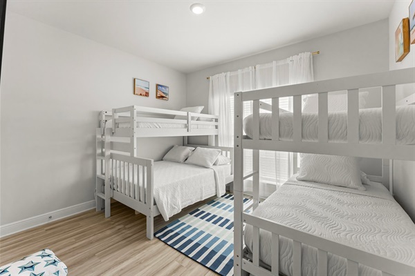 This bunkroom is perfect for all the kids to stay together and has a pull out trundle