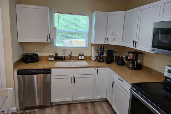 Nespresso, drip coffee maker, and kettle for your morning coffee or tea.