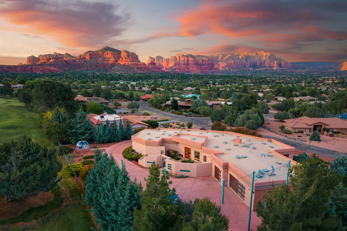 Your private luxury desert oasis. This stunning twilight view showcases the massive scale of Elara Retreats and its seamless integration into the landscape.