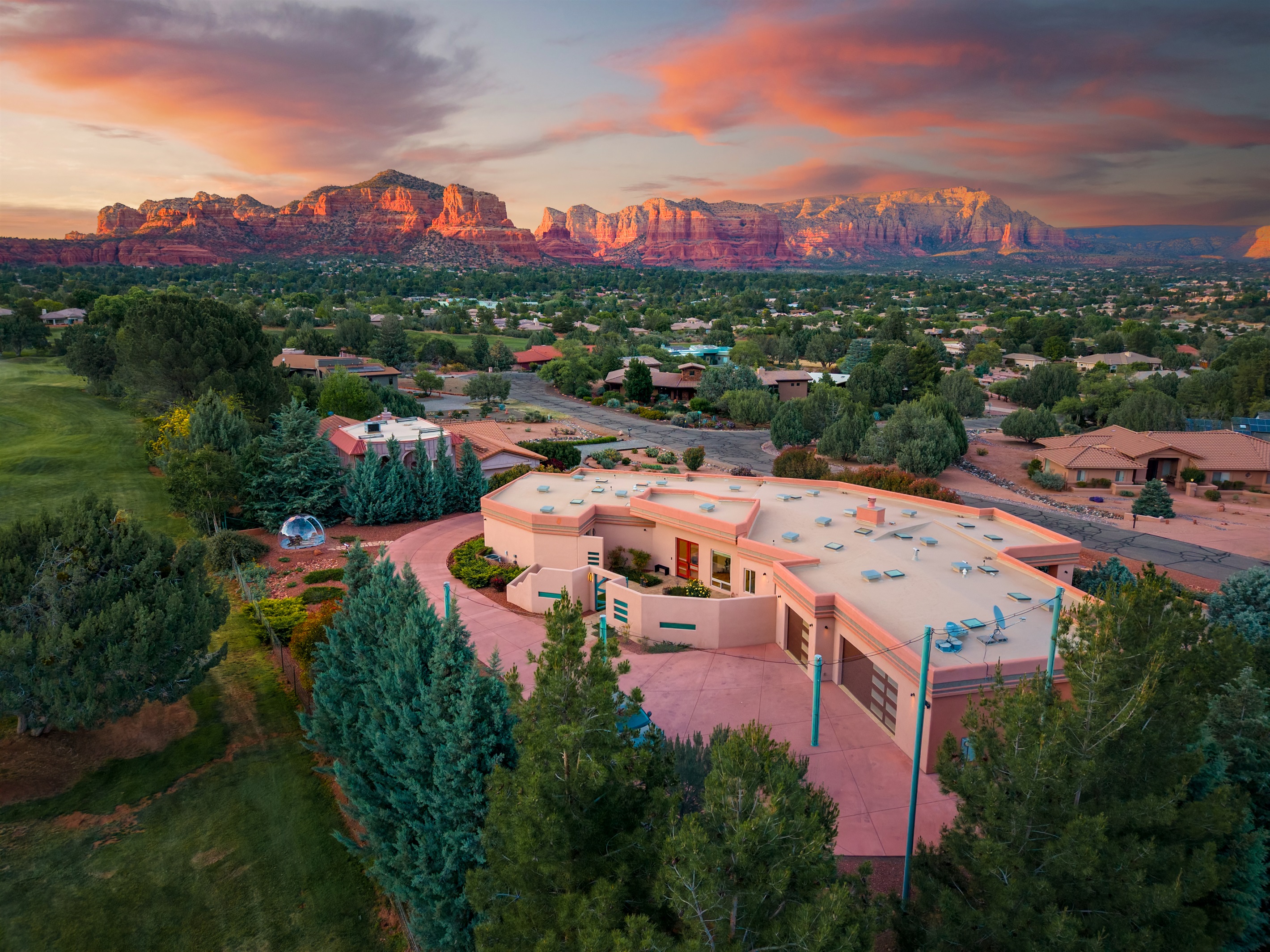 Your private luxury desert oasis. This stunning twilight view showcases the massive scale of Elara Retreats and its seamless integration into the landscape.
