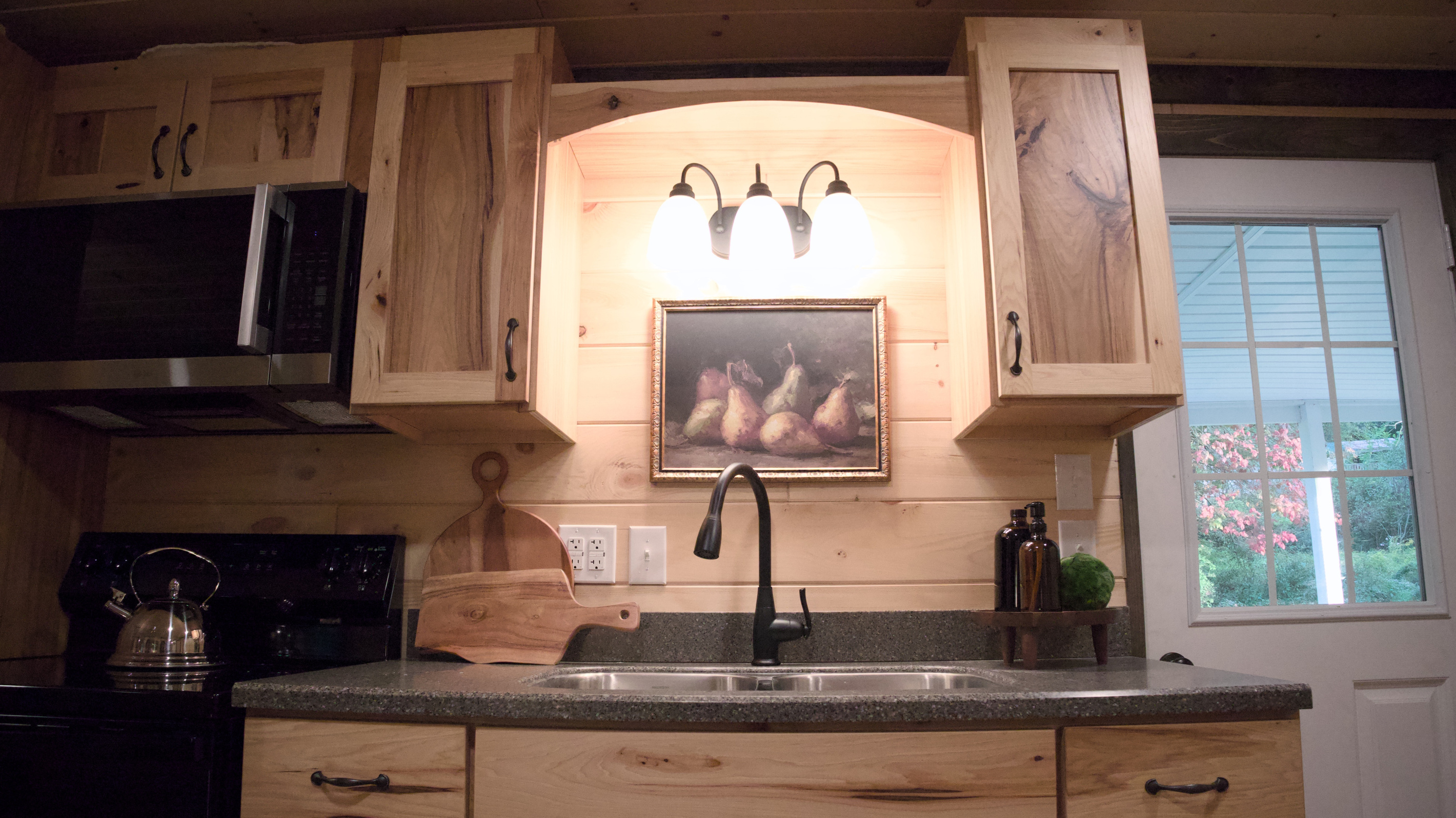 Sink area. Door goes to the back porch (also used as the entry door)