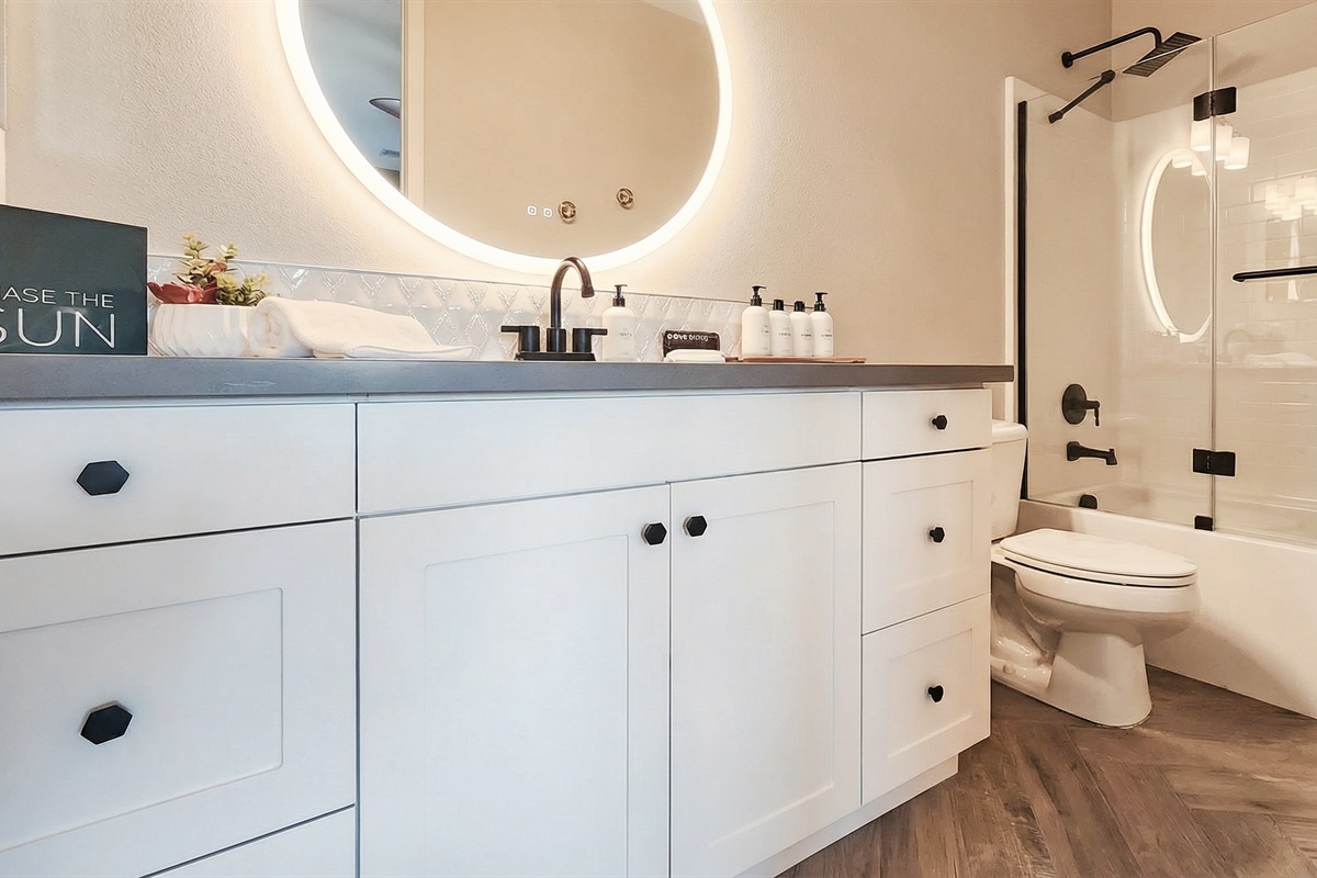 Ensuite bathroom #2 with bathtub / shower combo.