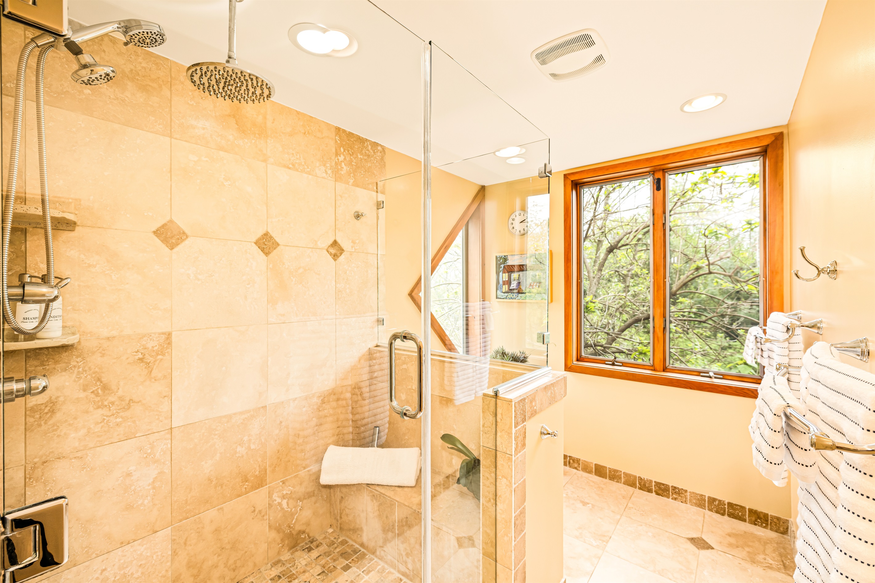 This has to be one of the coolest showers! Enjoy views out both windows while enjoying all 3 shower heads!
