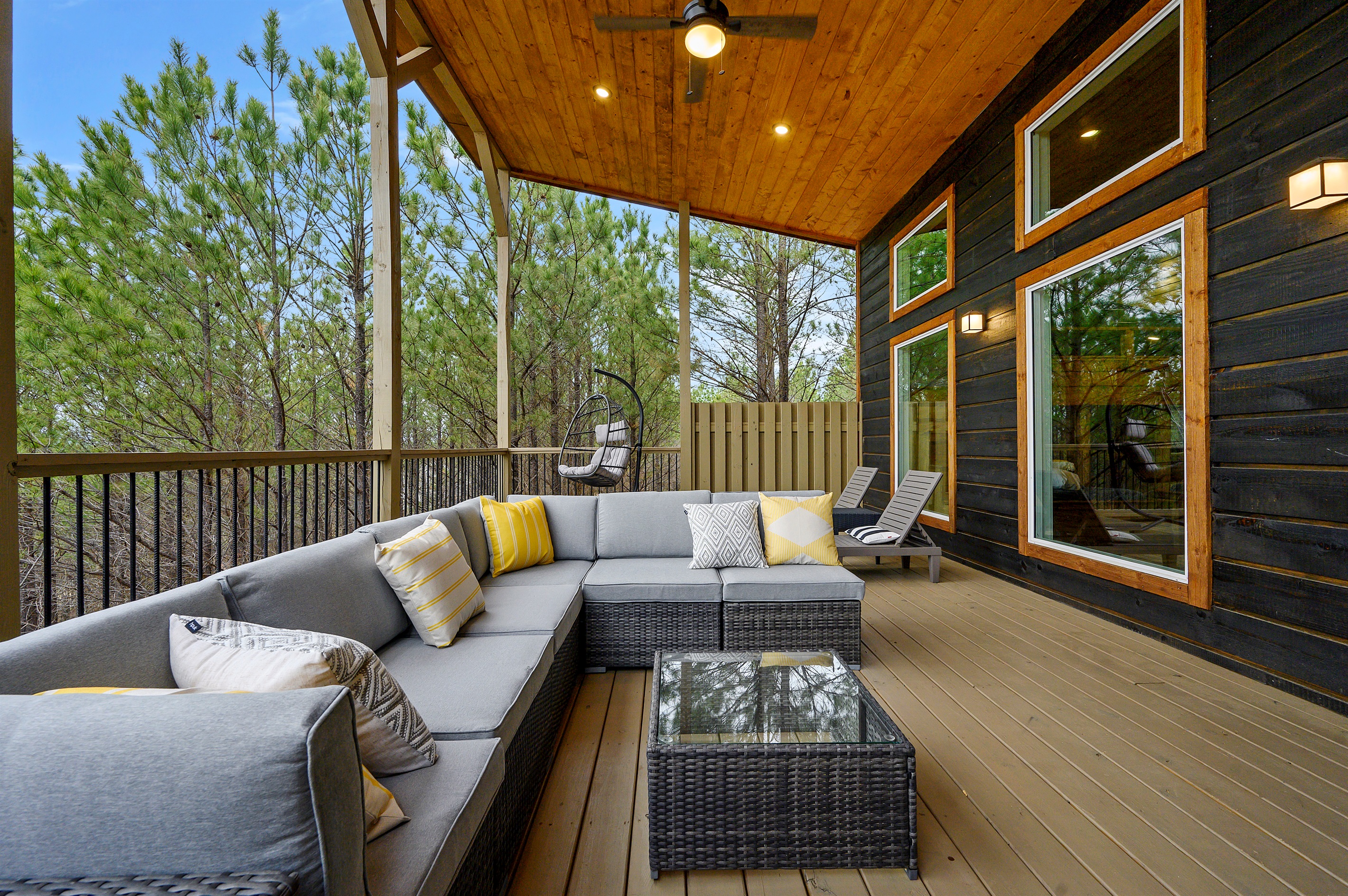 An inviting outdoor patio with comfortable seating and TV, ideal for chill evenings and casual hangouts. 🌙