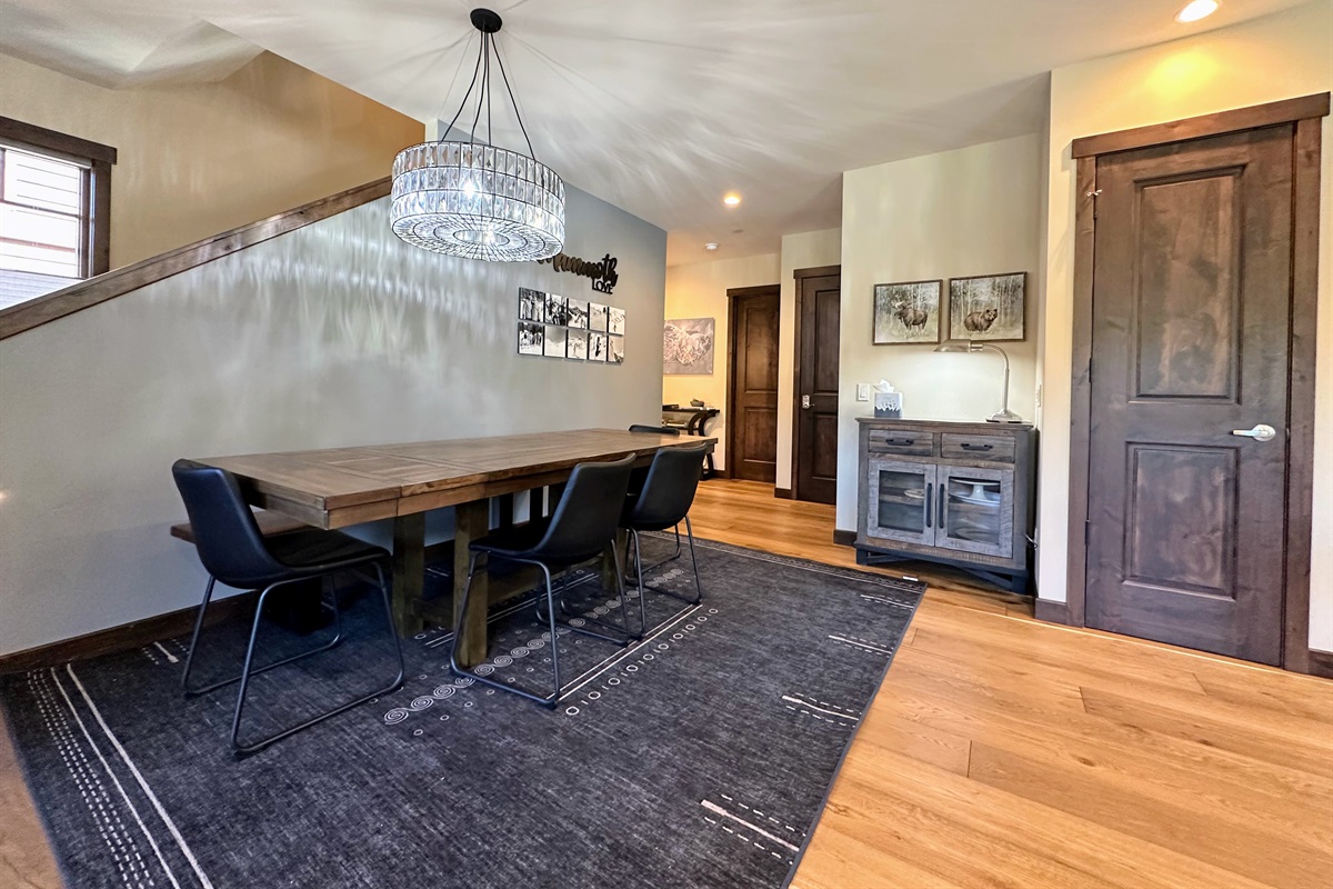 This spacious dining room with a roomy bench table is your go-to spot for shared meals, friendly competitions, or a productive workday—because sometimes, the best ideas happen over good food and great company.