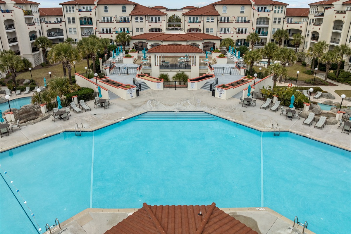 Soak up the sun at Villa Capriani&rsquo;s expansive oceanfront pool, one of the largest on the island, surrounded by loungers and stunning views