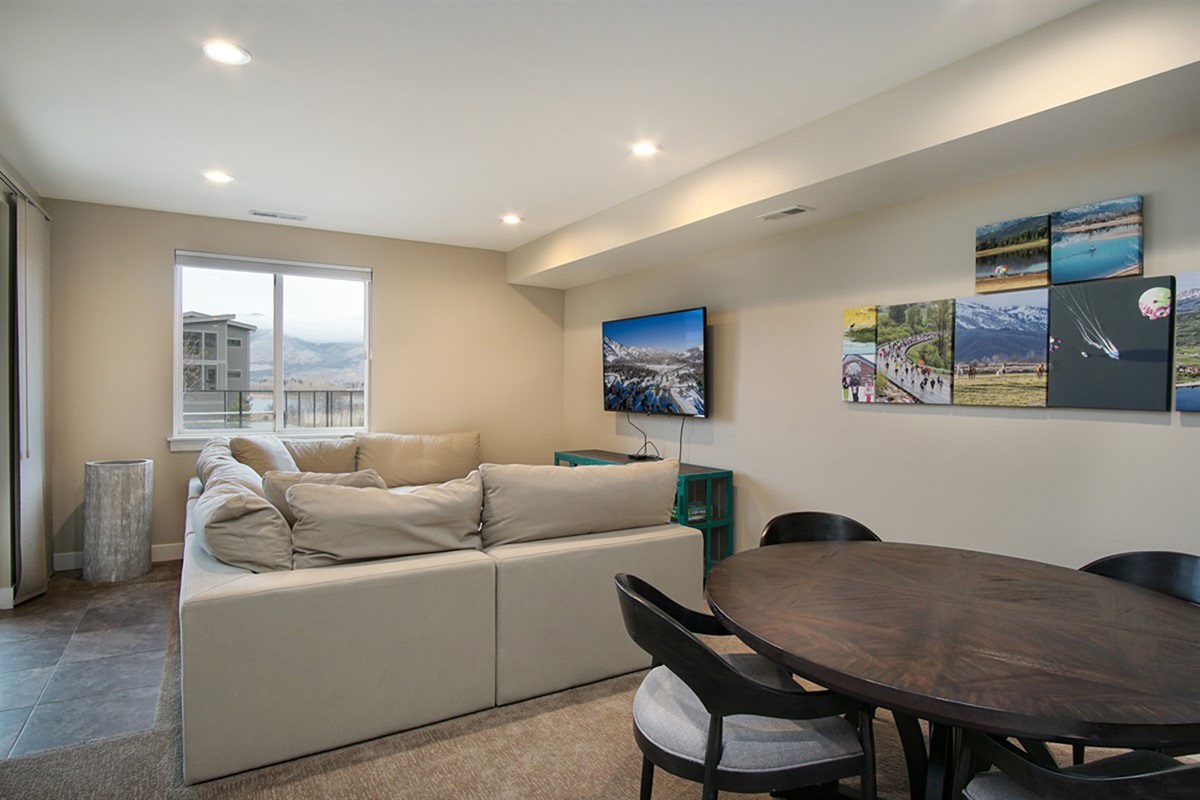 Lower-level living area with comfortable seating—ideal for movie nights or relaxing.