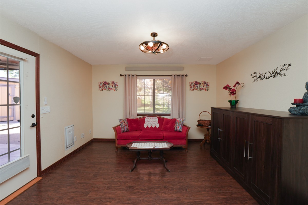 Private, flexible den space with backyard access and doggy door—perfect for pets, playtime, or quiet downtime.