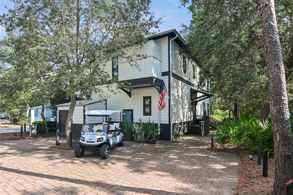 Front Entry, Shed & Parking 
Parking for 2 vehicles (max) on the paved driveway.  The shed is stocked with five bikes, beach chairs, umbrellas, soft coolers & the 6-seater LSV (Low Speed Vehicle)—everything you need for carefree 30A beach days! ☀️