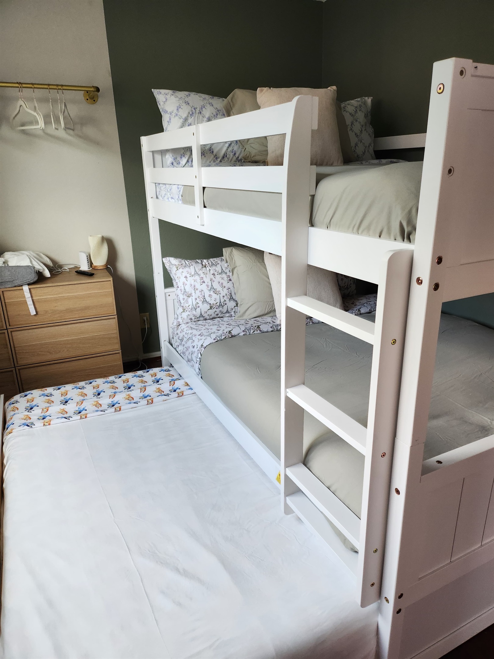 Spacious full-over-full bunk bed with twin trundle (lower bed suitable for toddlers).