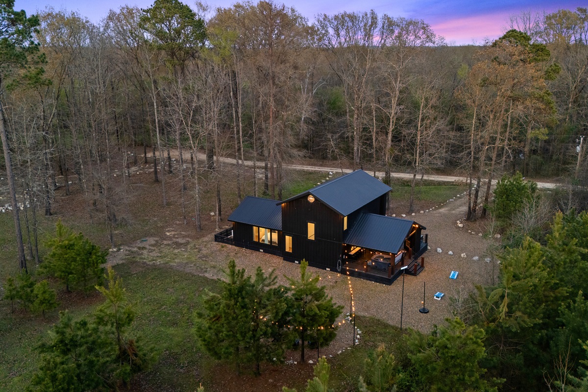 An aerial perspective captures the full layout of the property along with the surrounding landscape, giving a great sense of the space.