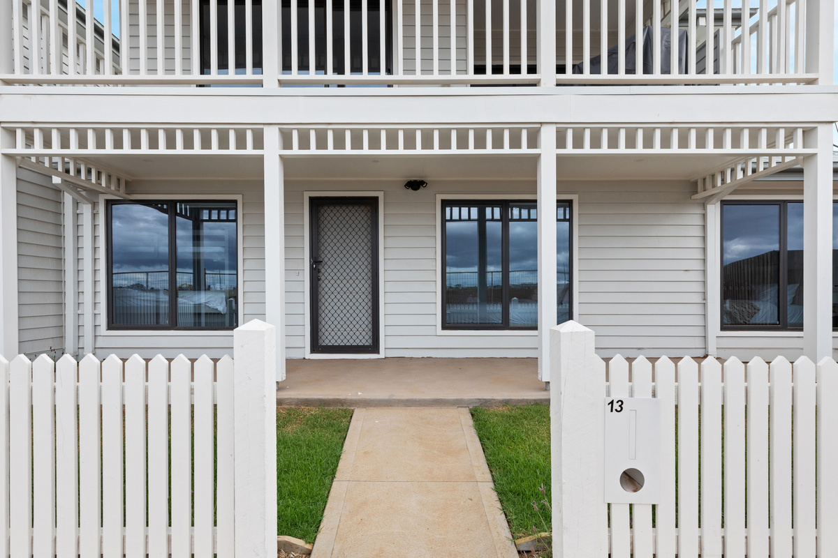 Entry path through the white picket gate to the covered front verandah and front door.