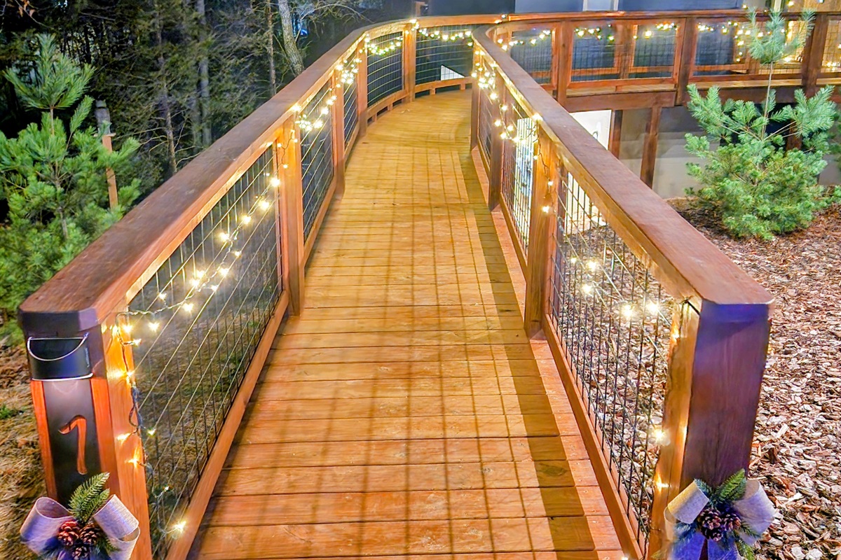 All the Christmas feels as you walk up to the Street 9 to 5 treehouse. 