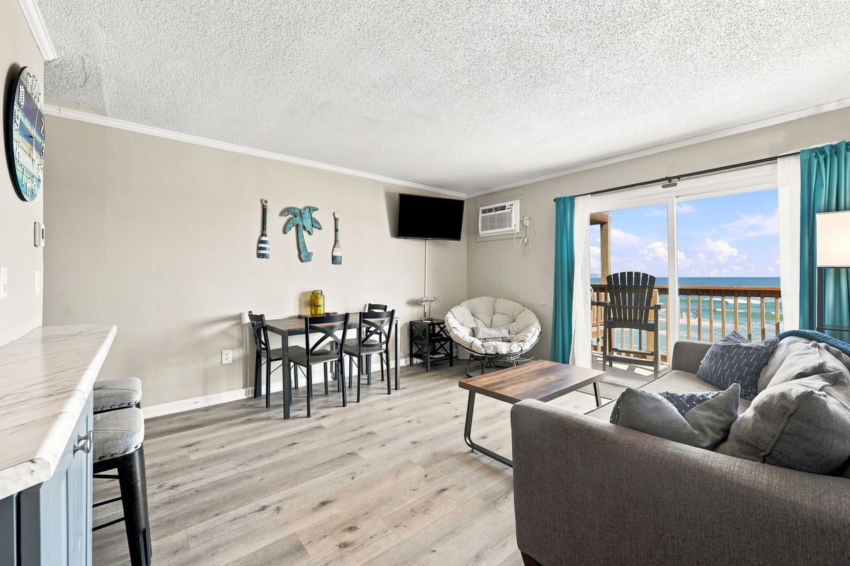 Gather, relax, and make memories in the spacious open-concept living area with room to unwind after a day at the beach