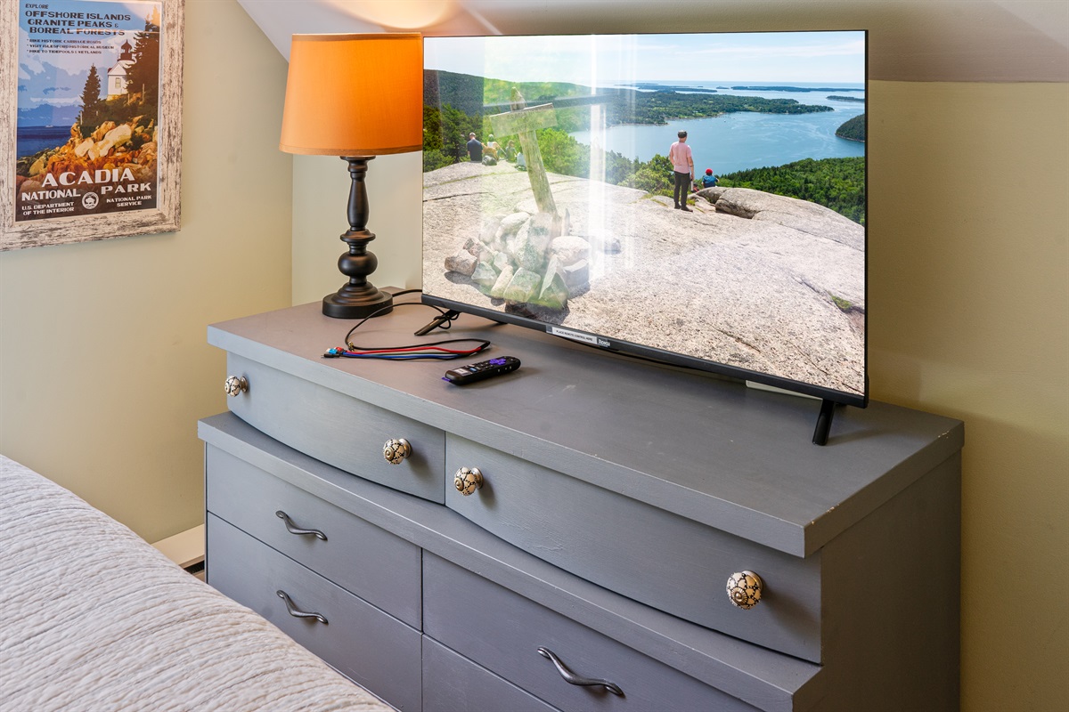 Curated comfort in every detail. Our Beech Mountain room features a new private Roku TV and a beautiful antique dresser with unique hardware. A thoughtful blend of historic charm and modern utility at your Hall Quarry Quiet Side basecamp.