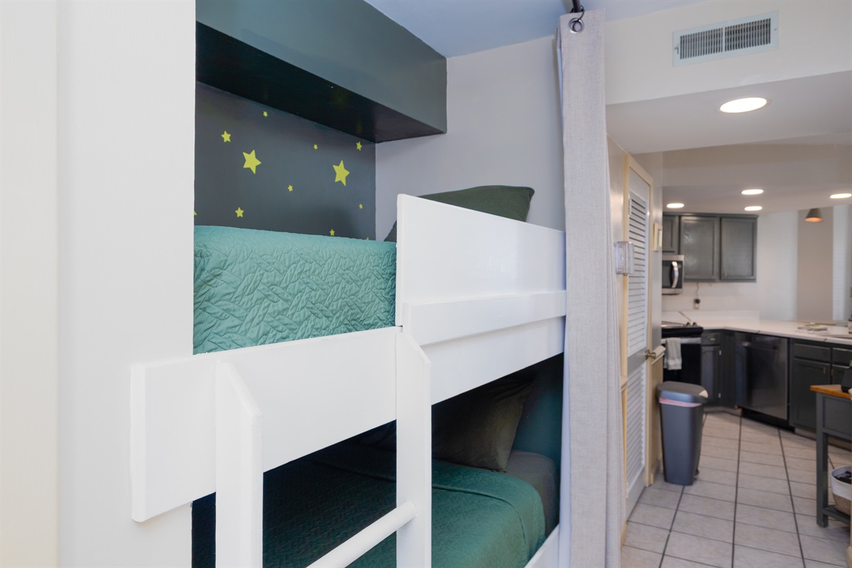 Bunk beds are nestled within the hallway