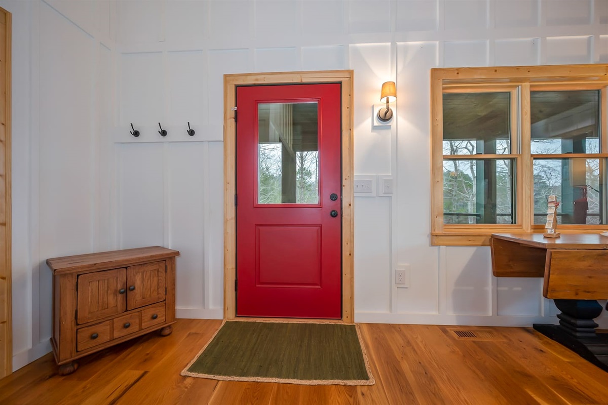 Door at dining room area leading to main level of back deck with screened in porch
