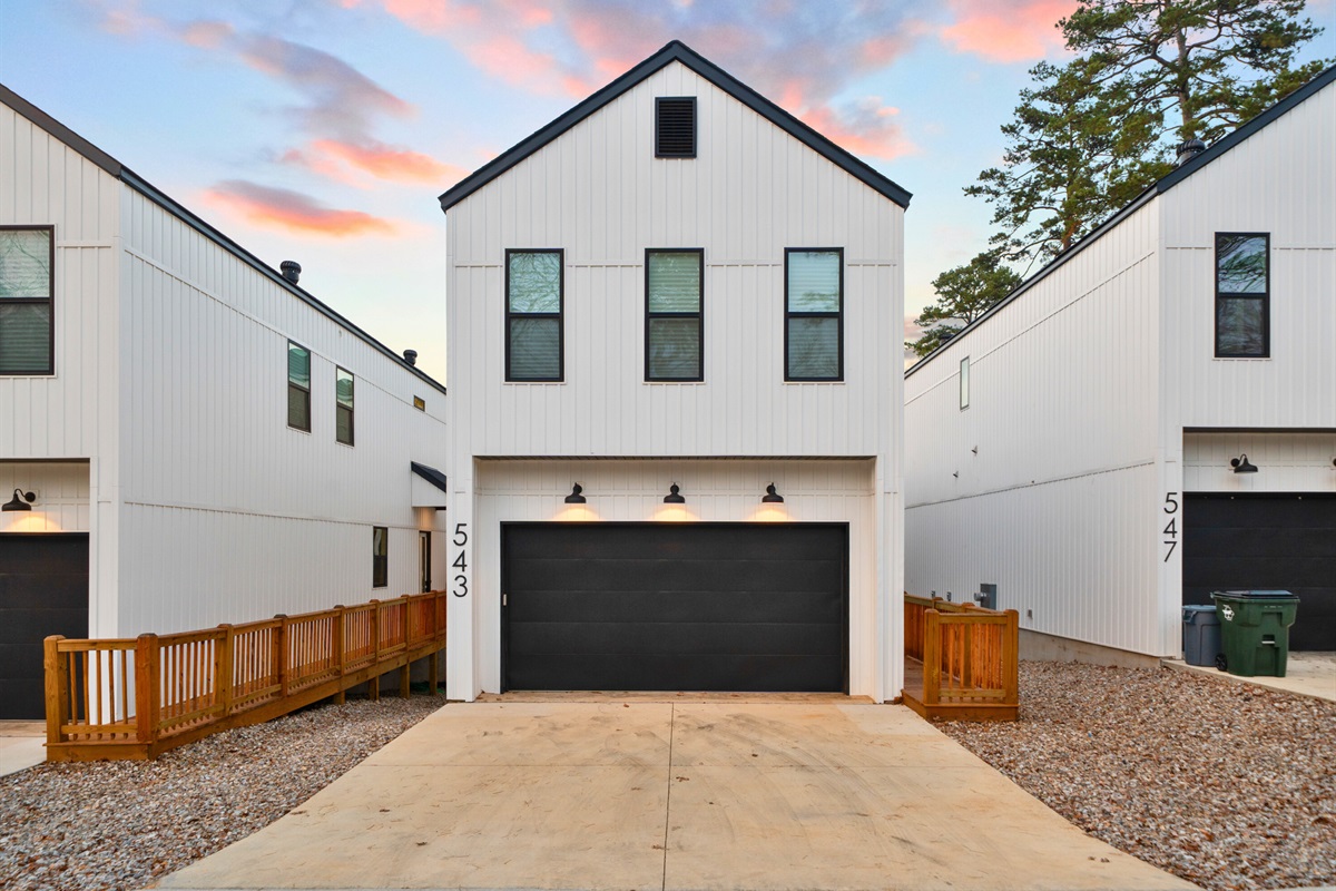 The homes sit along the water, creating a relaxed and private lakeside feel.