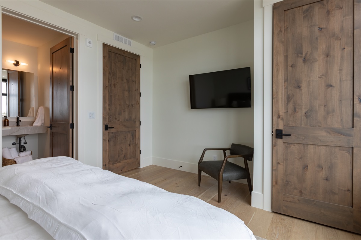 Middle Teton - Stay cool and connected with a ceiling fan and wall-mounted smart TV in suite two.