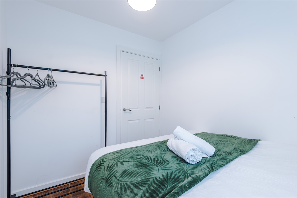 Each bedroom benefits from a clothes rail and hangers