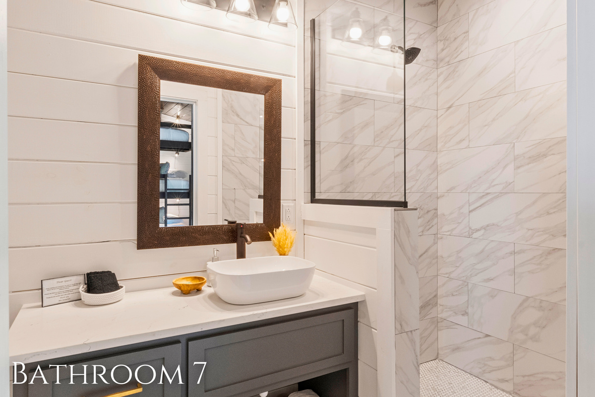 Sleek Comfort: Freshen up in style in this chic bathroom with pristine finishes&mdash;a perfect blend of luxury and comfort for your stay.