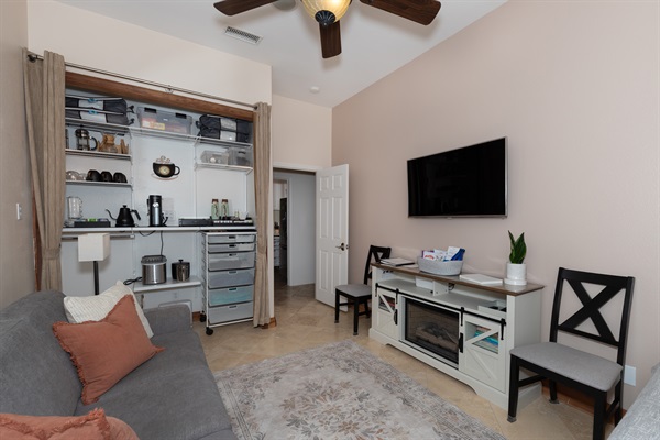 Cozy living area with Smart TV, seating, and dining nook