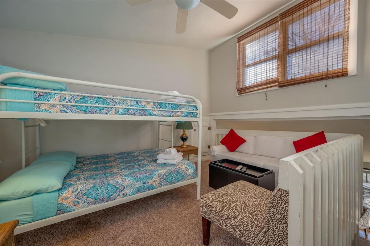 Upstairs loft with full bed bunk and seating