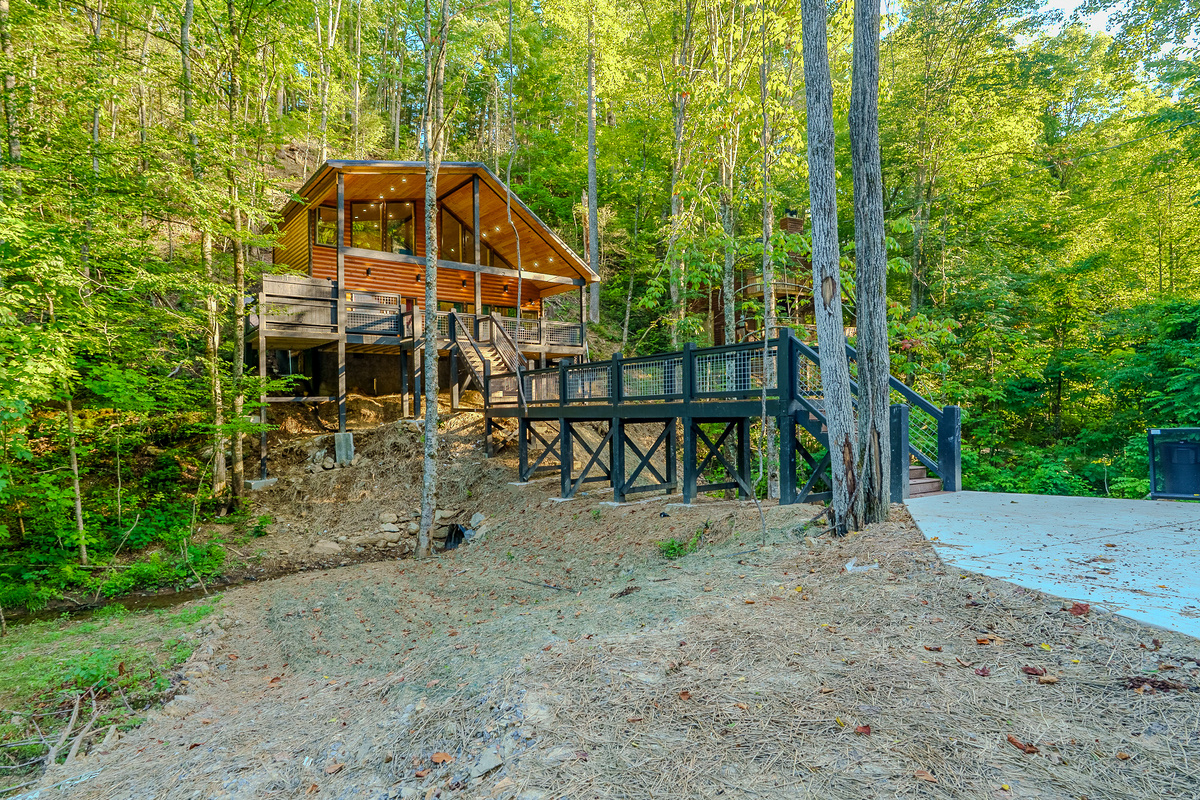 Cross the private bridge and discover your peaceful Smoky Mountain getaway