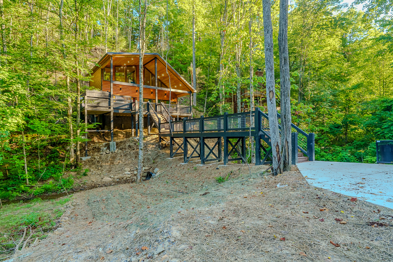 Cross the private bridge and discover your peaceful Smoky Mountain getaway