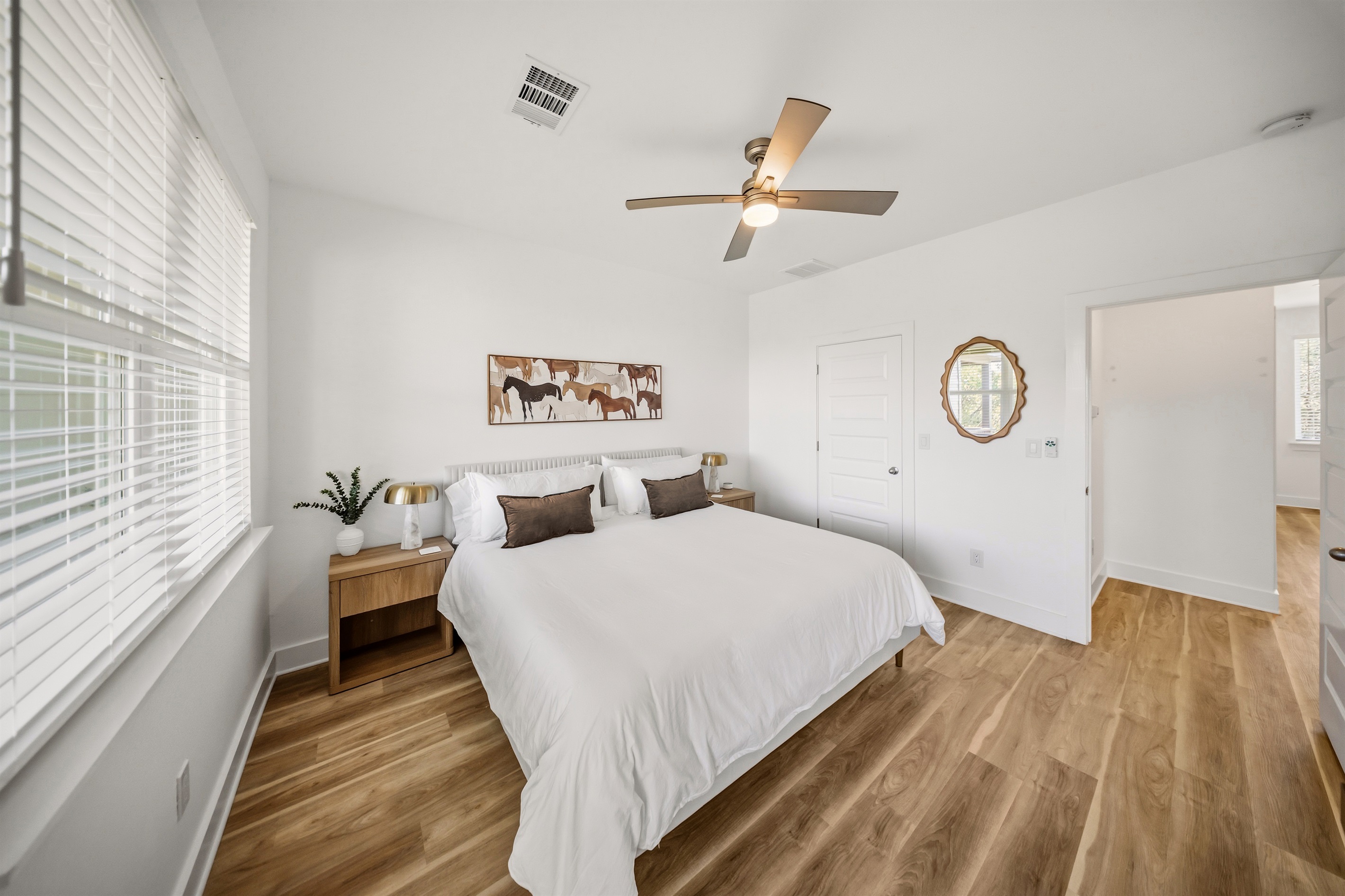 Modern primary suite with a king bed