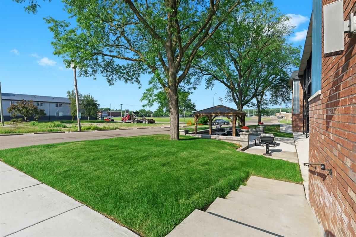 Grassy courtyard with space to walk, relax, or enjoy a breath of fresh air.