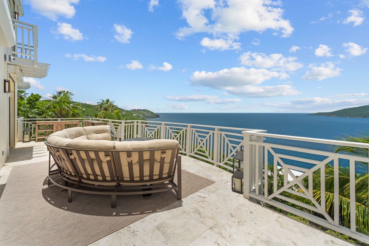 Upper-level balcony with panoramic ocean views, ideal for coffee at sunrise or nightcaps under the stars.