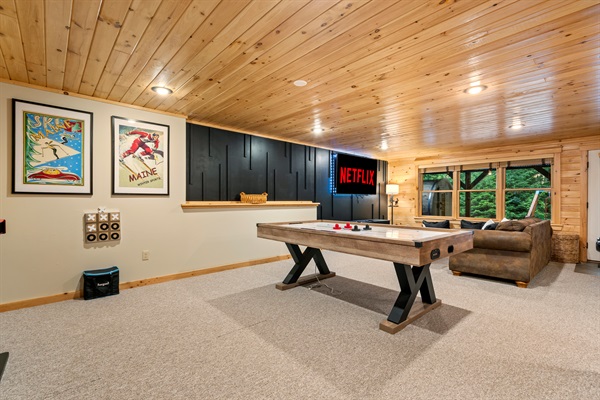 The lower level is all about fun—game room, second living area, and a space just for the kids.