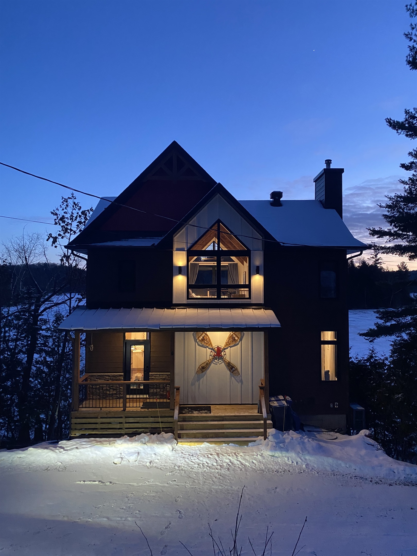 Cottage viewed from driveway at dusk