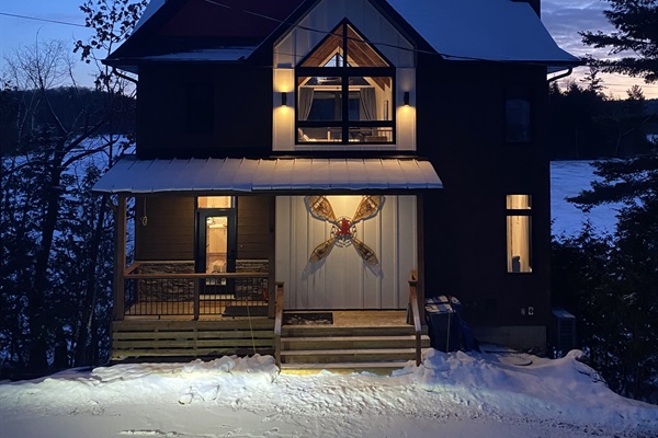 Cottage viewed from driveway at dusk