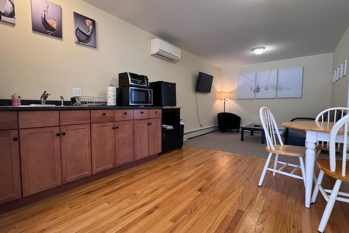 Open concept with Kitchenette, Living room, and dining area with both bedrooms and bathrooms off of the space