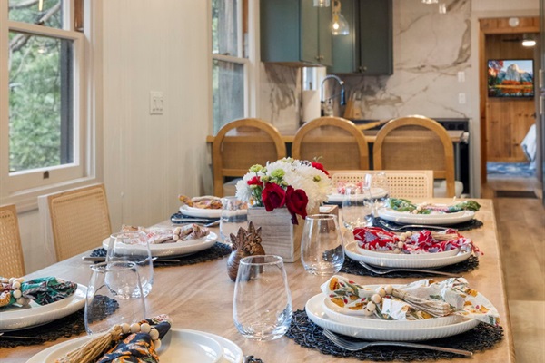 Dining table for up to 10. Up to 6 chairs and a large bench is available for seating. Plenty of dishes for your large groups as well.