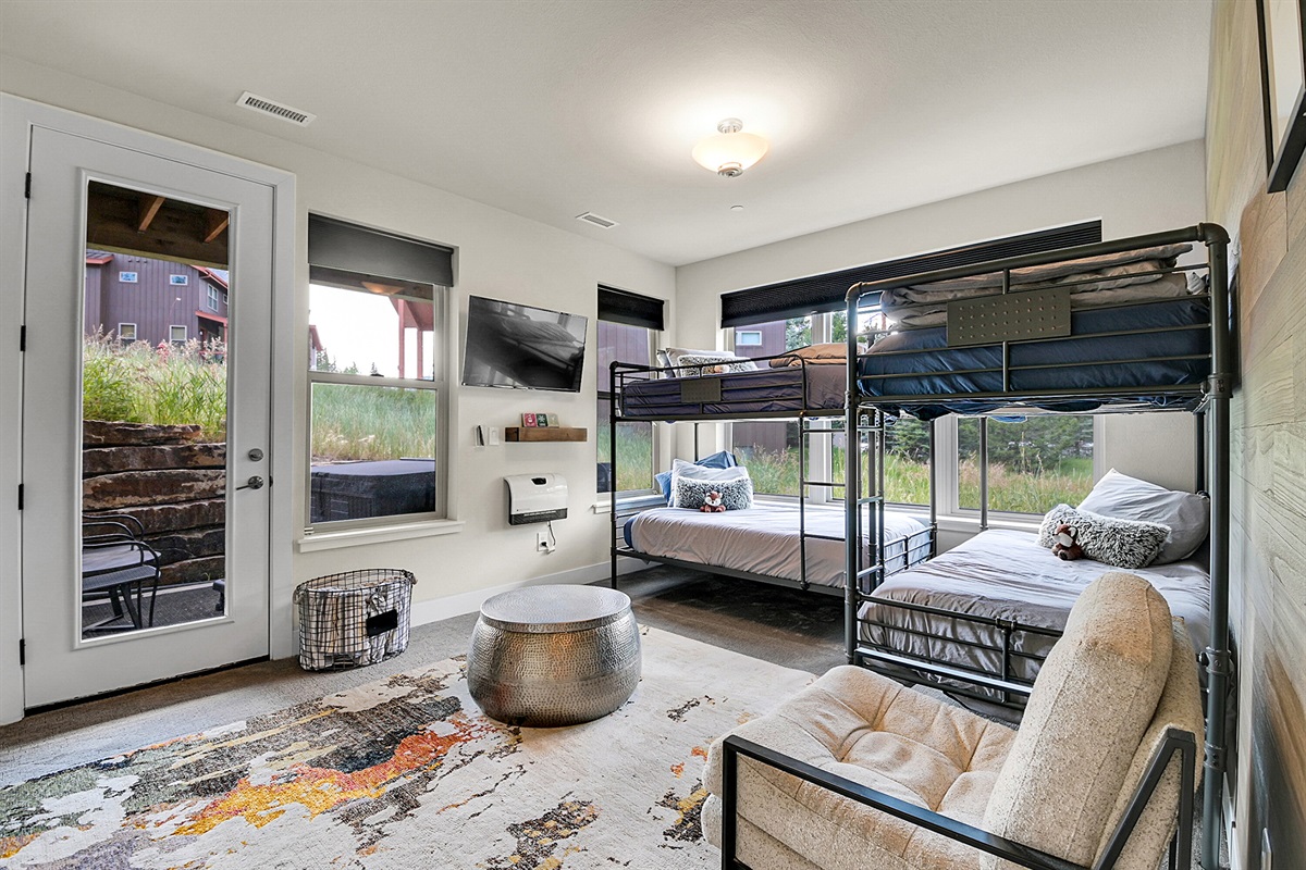 Bunk room showing walk out deck for the Hot Tub