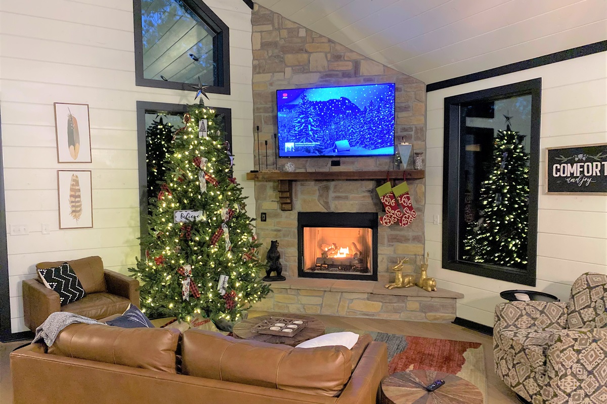 Warm up by the fire under twinkling holiday lights