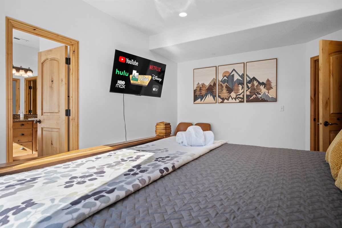 Unwind in bed as you stream your favorite shows on our smart TV!