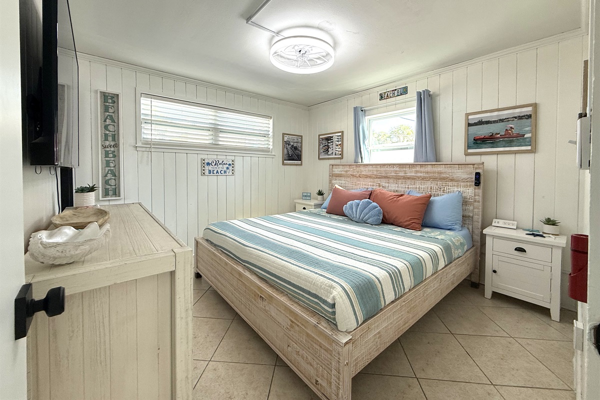 Primary Bedroom with King Bed & Retro Photos & 65" TV