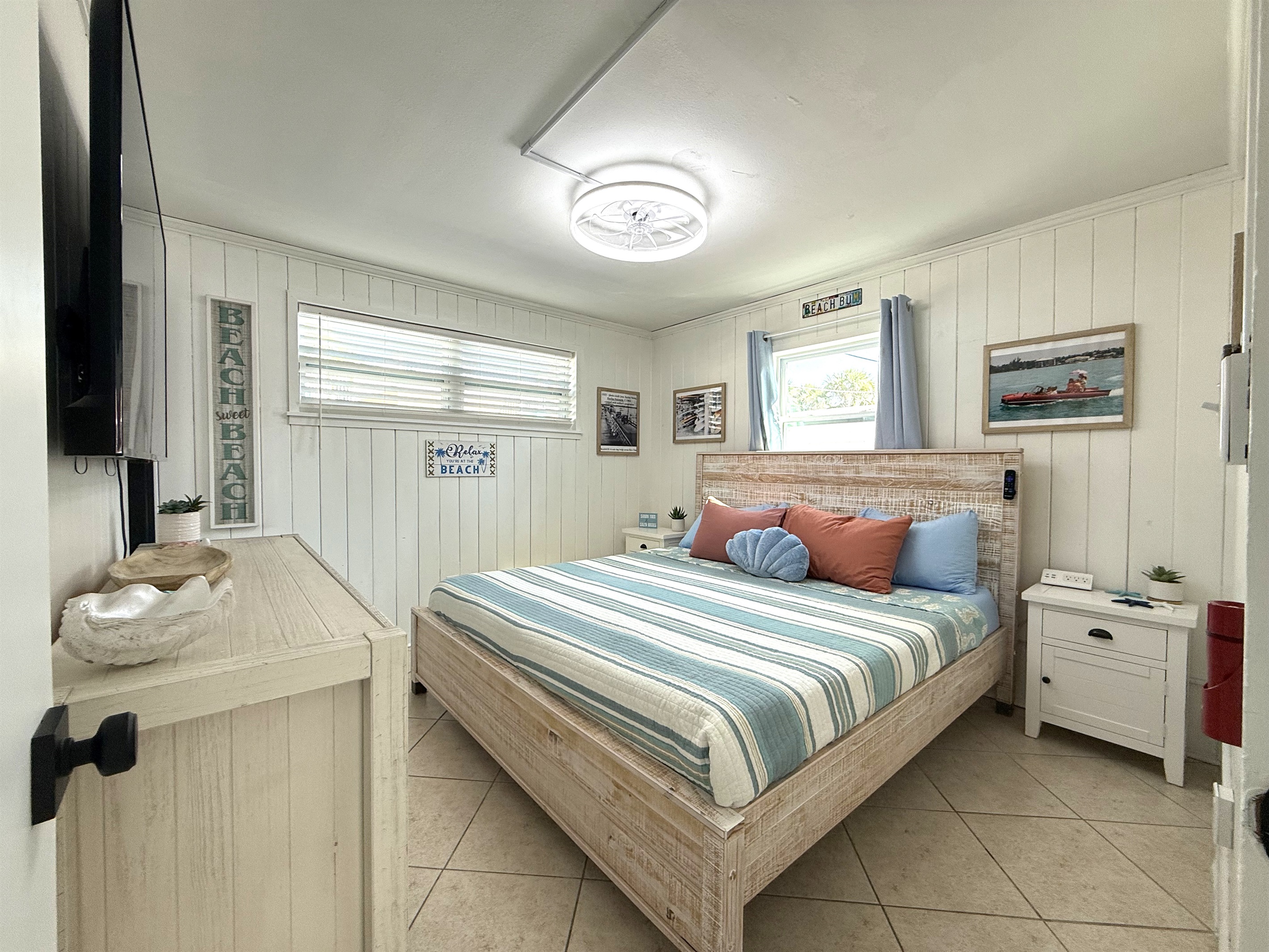 Primary Bedroom with King Bed & Retro Photos & 65" TV