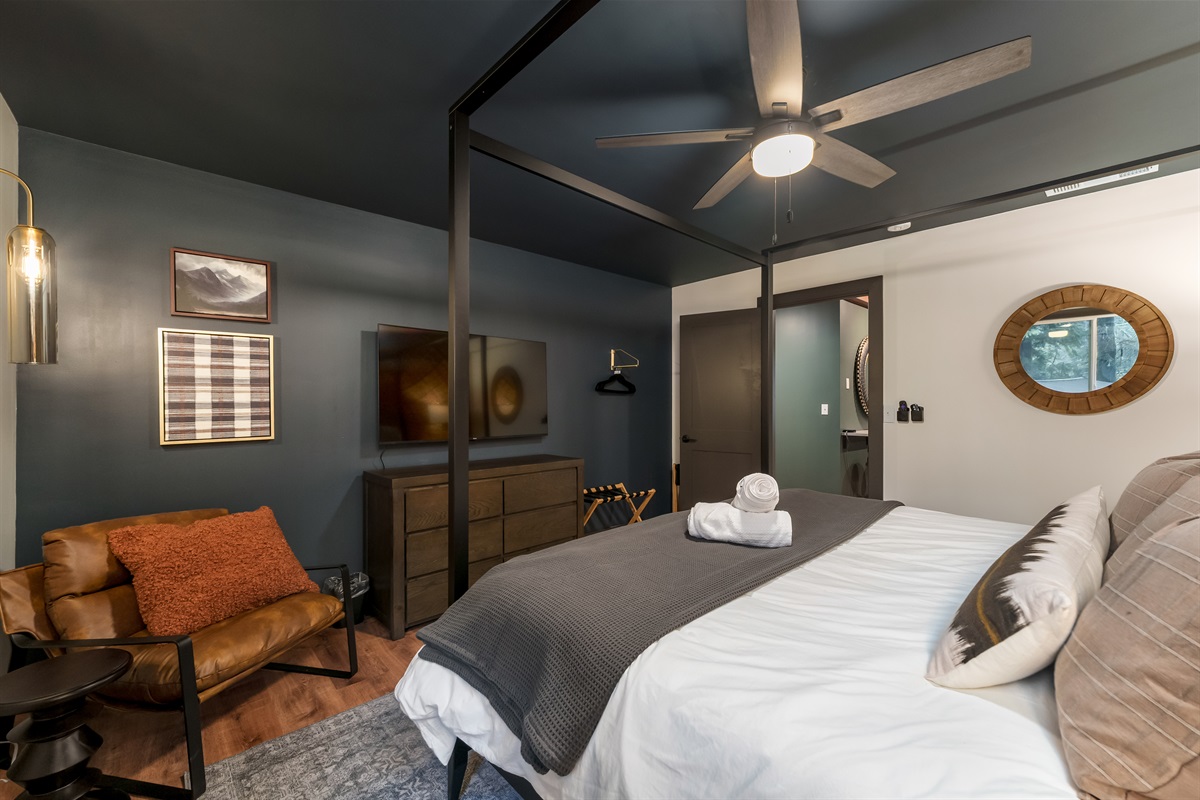 Relax in style with a spacious king bed, calming mountain-inspired décor, and a cozy reading nook—designed for quiet mornings and restful evenings.
