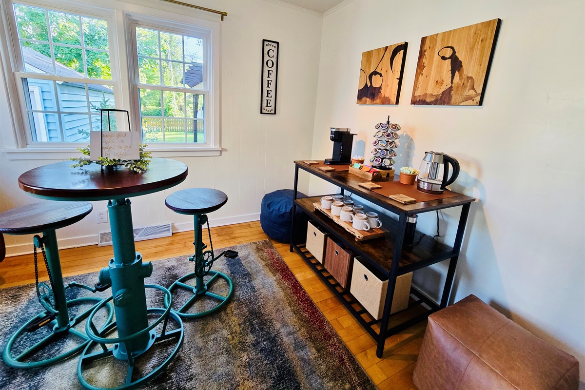 Start your day in style—our industrial-chic morning nook features a high table, quirky bike-pedal stools, and a fully stocked coffee station for your perfect brew.
