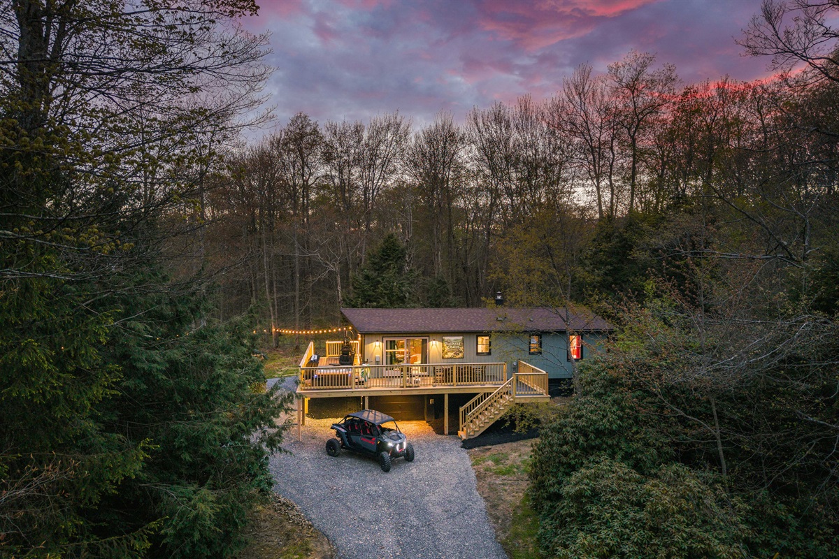 🚙 Home base in the woods, vehicles tucked in for the night.