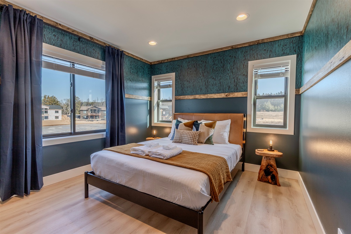 Upstairs queen memory foam bedroom with Roku TV.