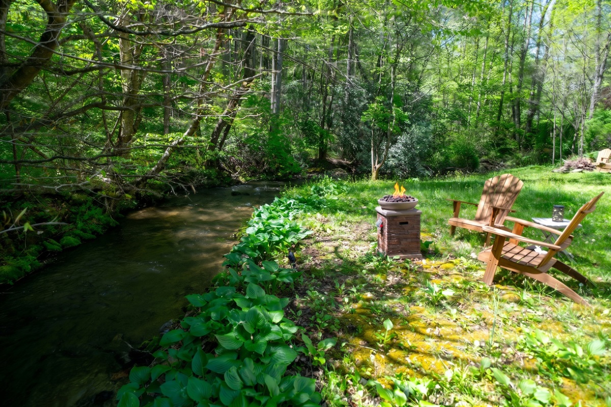 Enjoy effortless evenings by the creek with a convenient propane fire pit- just turn it on and relax.