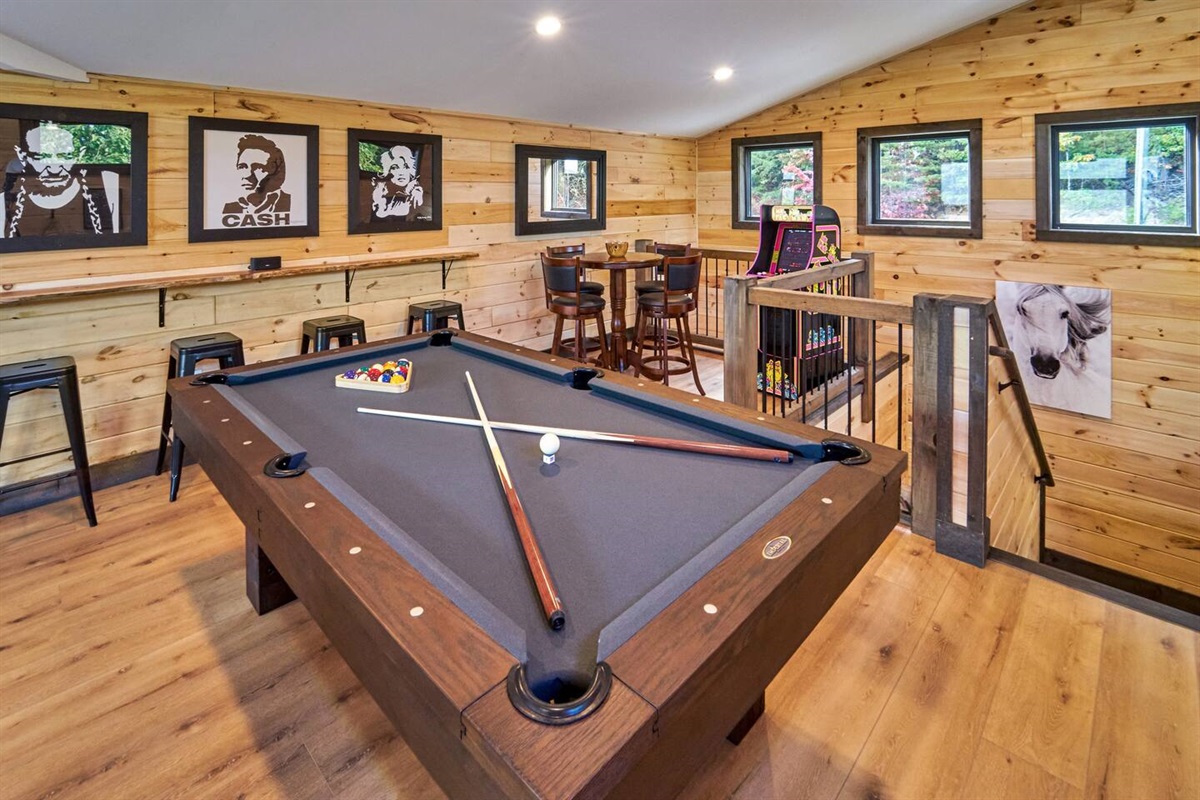 Billiards, Pacman, card table, bar area for some friendly competition and fun.