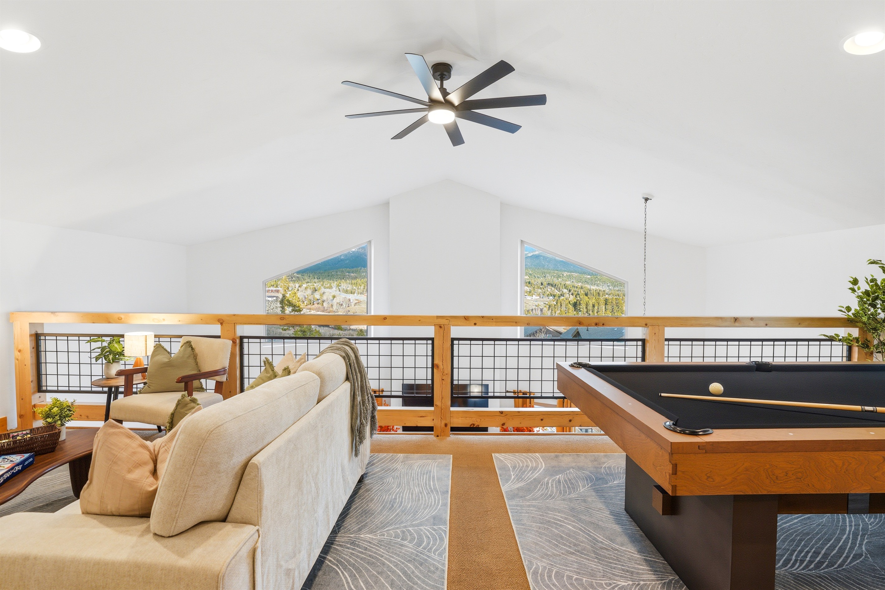 Perched above it all, this is your cozy hideaway with a front-row seat to the heart of the home below and the mountain views outside.